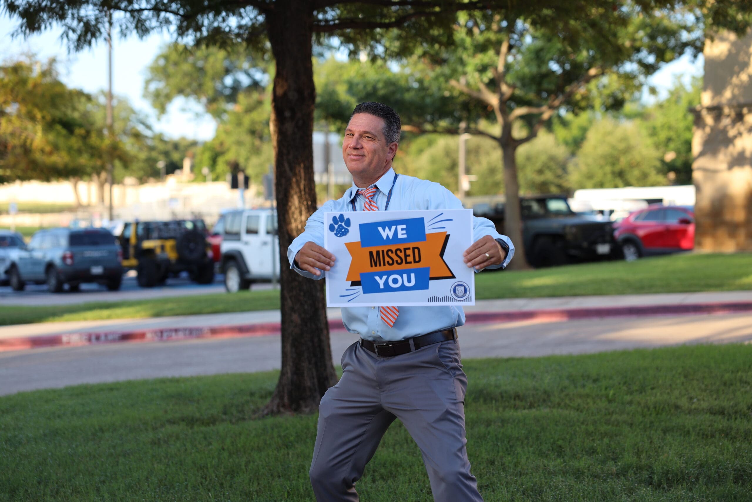 teacher welcoming students back to school