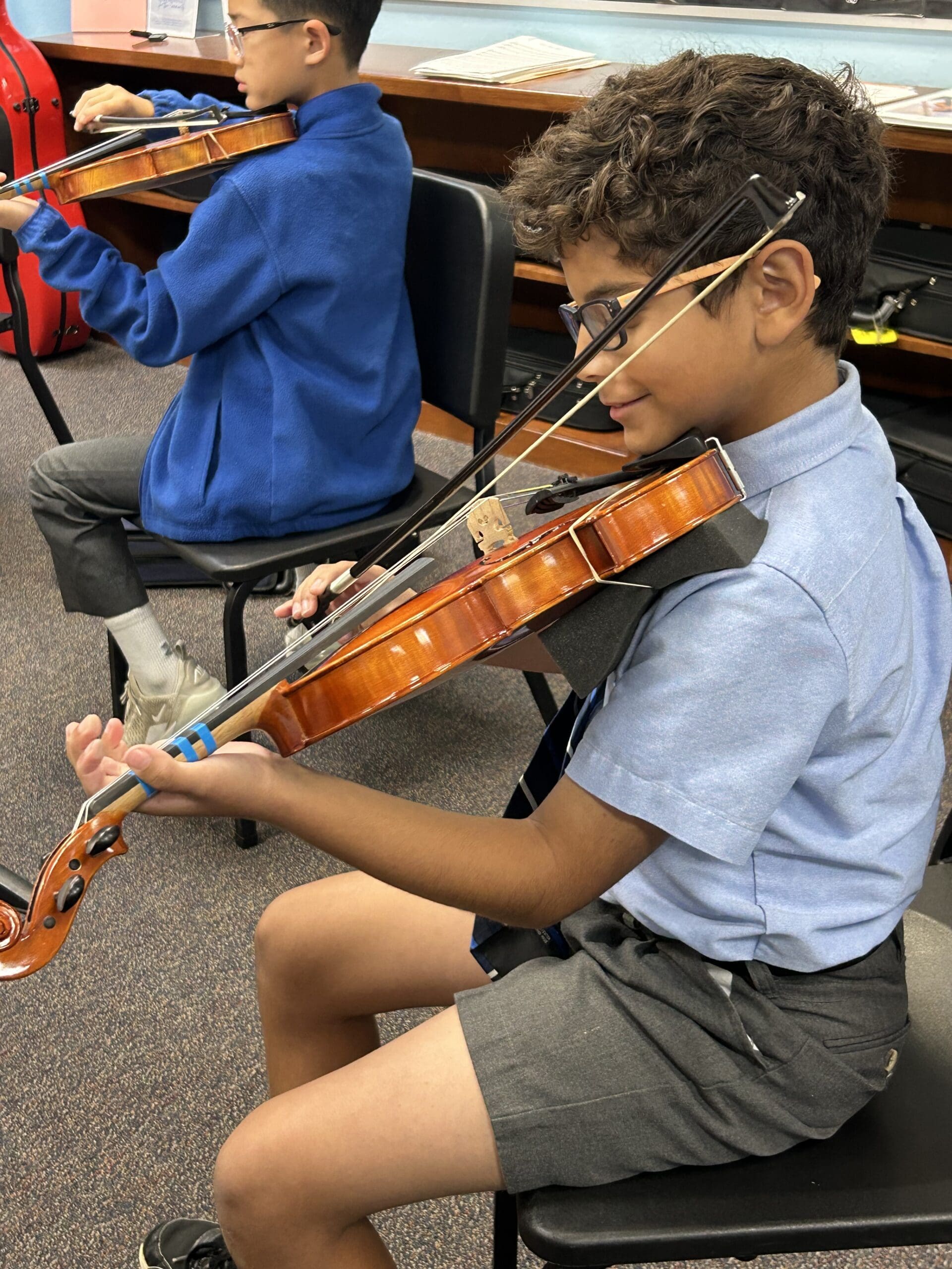middle school boy playing violin